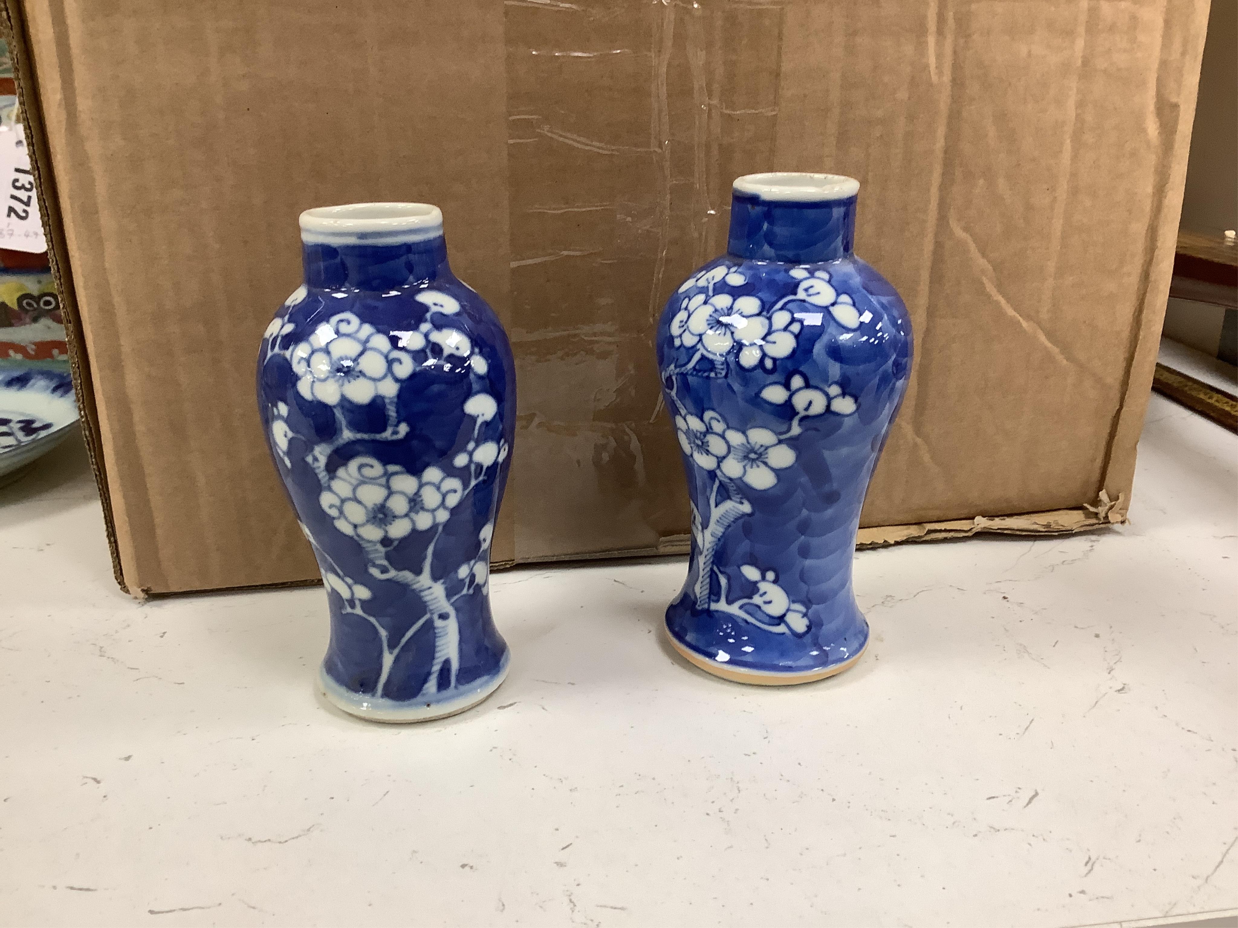 A group of five Chinese blue and white prunus vases, one with cover, late 19th century, tallest 20cm. Condition - varies